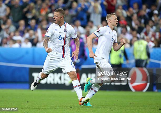 Ragnar Sigurdsson and Kolbeinn Sigthorsson of Iceland celebrate the first goal of their team during the UEFA Euro 2016 quarter final match between...