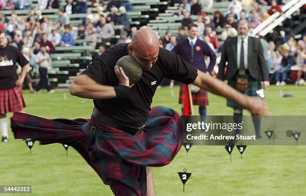 Competitor is pictured during a stone throwing competitiion at the Braemar Royal Highland Gathering on September 3, 2005 in Braemar, Scotland. The...