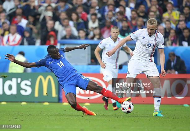 Blaise Matuidi of France and Kolbeinn Sigthorsson of Iceland in action during the UEFA Euro 2016 quarter final match between France and Iceland at...