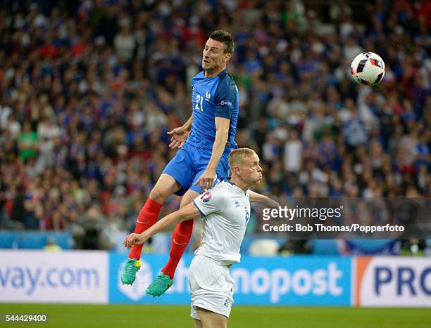 Laurent Koscielny of France with Kolbeinn Sigthorsson of Iceland during the UEFA EURO 2016 quarter final match between France and Iceland at Stade de...
