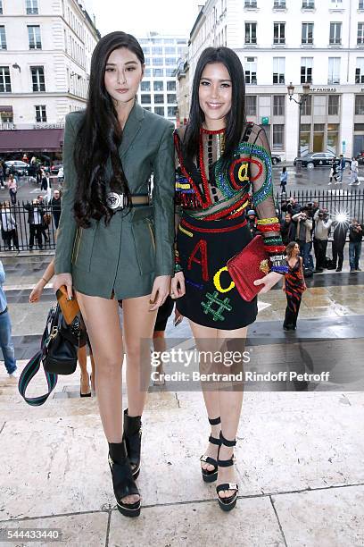 Elisa Jan and Juwei Teoh attend the Atelier Versace Haute Couture Fall/Winter 2016-2017 show as part of Paris Fashion Week on July 3, 2016 in Paris,...