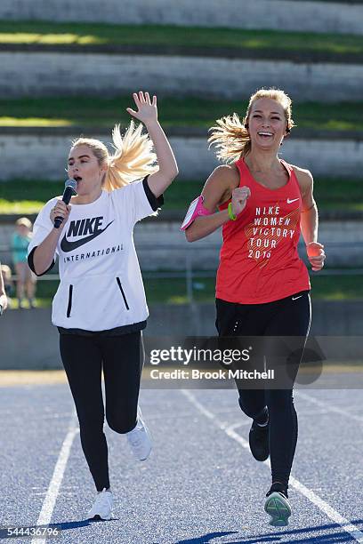 Carissa Walford cheers on Anna Heinrich at the finish of the Nike Women's Half Marathon at Sydney Olympic Park on July 3, 2016 in Sydney, Australia.