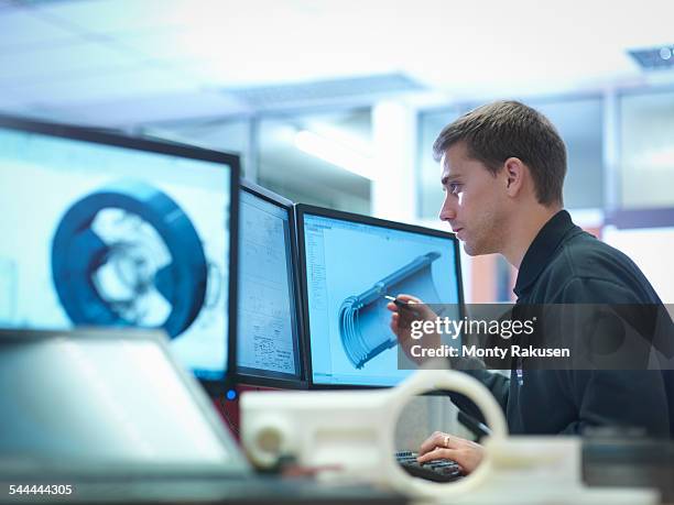 cad designer working on engineering designs - microsoft stock pictures, royalty-free photos & images