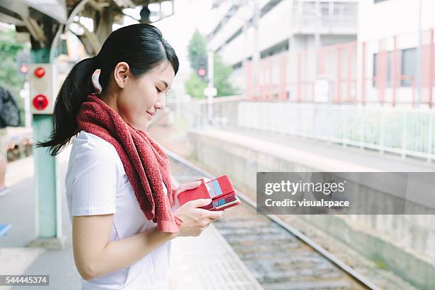 young woman checking her social media - weekend update stock pictures, royalty-free photos & images