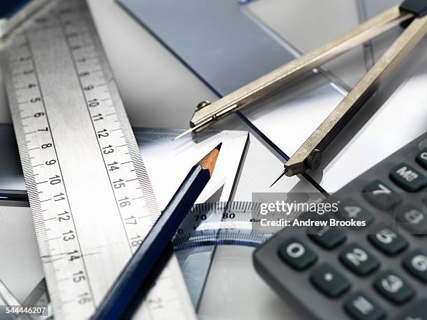 drawing equipment, sitting on engineering technical drawing - protractor stock pictures, royalty-free photos & images