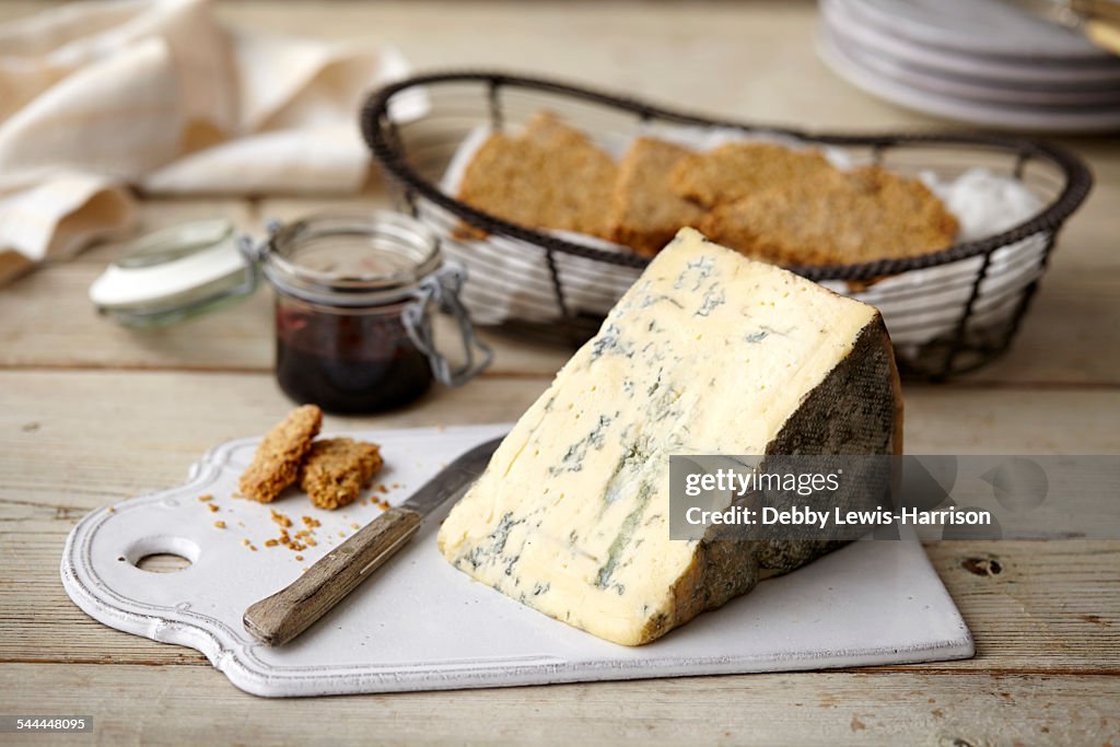 Block of stilton cheese, bread, jam