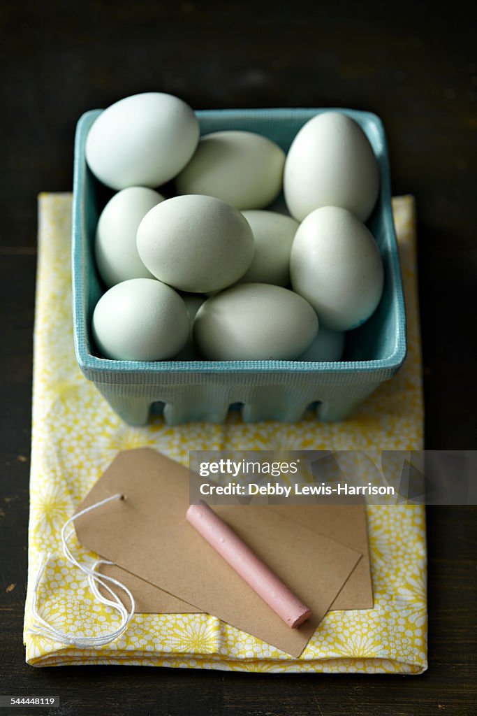 Chicken eggs, chalk, tag, kitchen towel