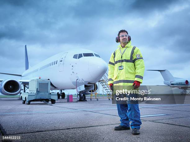 airport worker on runway, portrait - aviation worker stockfoto's en -beelden