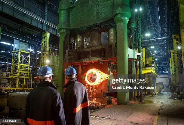 steelworkers with 10,000 tonne forging press in steelworks - sheffield steel stock pictures, royalty-free photos & images