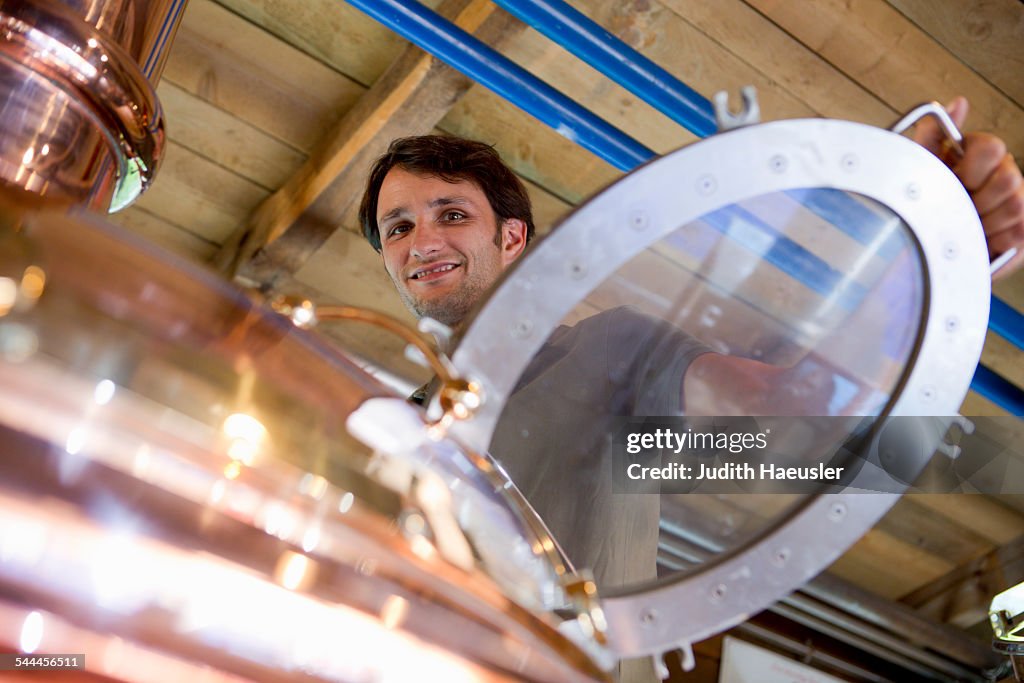 Male brewer working in brewhouse