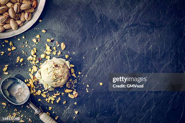 delicious pistachio ice cream on a background - frozen sweet food stock pictures, royalty-free photos & images