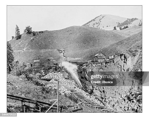 antique photograph of placer mining scene in california (usa)-19th century. - hydraulic platform stock illustrations
