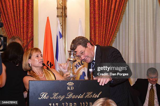 Former Foreign Minister of Australia Alexander Downer receives a silver cup during an event in the King David Hotel, Jerusalem, Israel, June 26,...