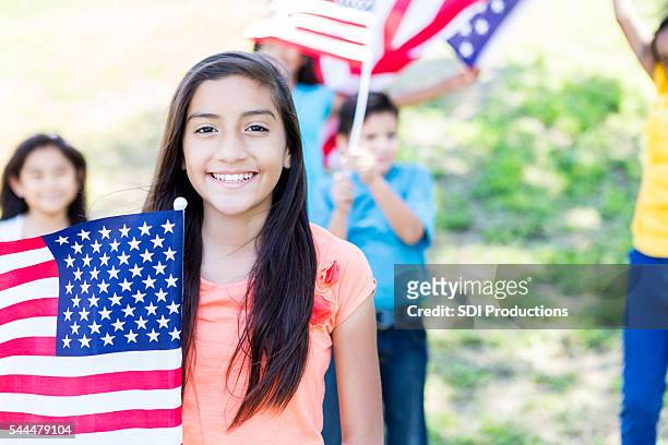 patriotic children wave american flags - child beauty pageant stock pictures, royalty-free photos & images