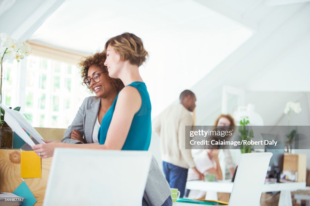 Four people at meeting in office