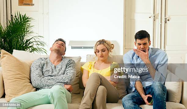 really bored - three people on couch stock pictures, royalty-free photos & images