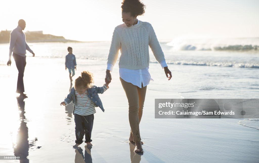 Happy family having fun on beach