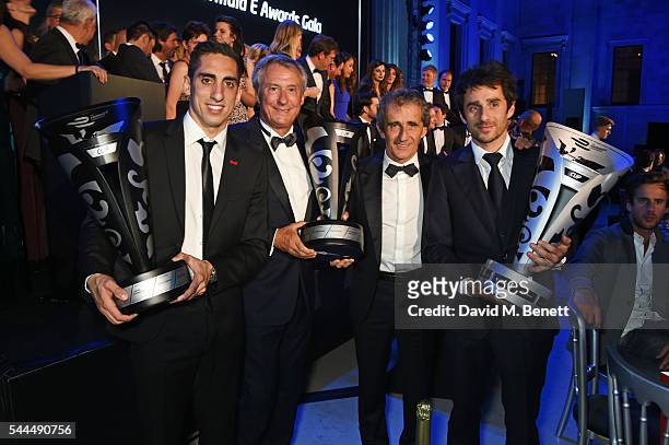 Sebastien Buemi, Jean-Paul Driot, Alain Prost and Nicolas Prost pose with their awards at the 2016 FIA Formula E Visa London ePrix gala dinner at The...