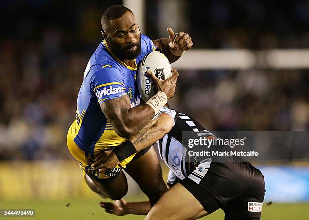 Semi Radradra of the Eels is tackled during the round 17 NRL match between the Cronulla Sharks and the Parramatta Eels at Southern Cross Group...