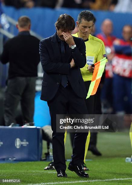 Italy manager Antonio Conte reacts during the penalty shoot out following the UEFA Euro 2016 Quarter Final match between Germany and Italy at Nouveau...