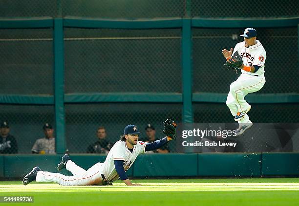 Jake Marisnick of the Houston Astros makes a diving catch on a line drive by Jose Abreu of the Chicago White Sox seventh inning as Carlos Gomez...