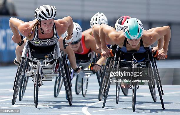 Tatyana McFadden, left, makes her way past Amanda McGrory, right, to a first-place finish in the Women's 1500 Meter Run during the 2016 U.S....