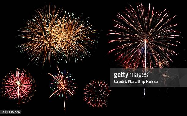 stockillustraties, clipart, cartoons en iconen met a variety of colorful fireworks isolated on black background - thai ethnicity