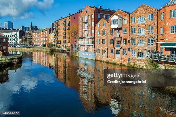 waterfront buildings along aire river, leeds, england, uk - leeds skyline stock pictures, royalty-free photos & images