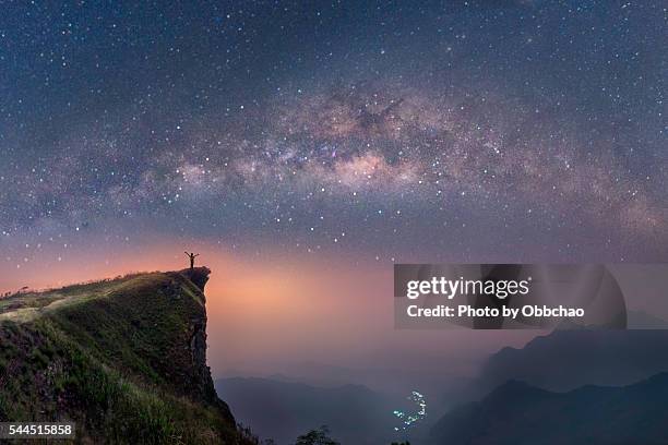 milky way over the mountains of chiang rai, thailand, phuchifha - 12星座 ストックフォトと画像