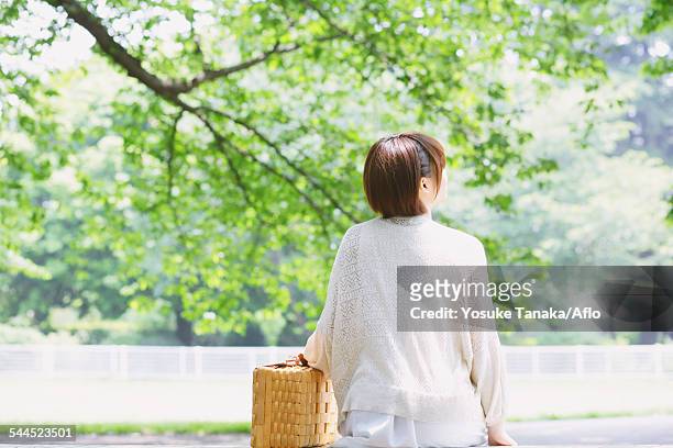 portrait of young japanese woman in a park - university student picnic stock pictures, royalty-free photos & images