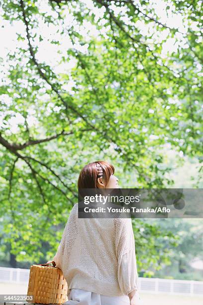 portrait of young japanese woman in a park - university student picnic stock pictures, royalty-free photos & images