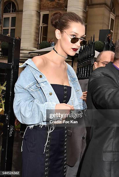 Bella Hadid leaves the Atelier Versace Haute Couture Fall/Winter 2016-2017 show as part of Paris Fashion Week on July 3, 2016 in Paris, France.