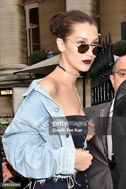 Bella Hadid leaves the Atelier Versace Haute Couture Fall/Winter 2016-2017 show as part of Paris Fashion Week on July 3, 2016 in Paris, France.
