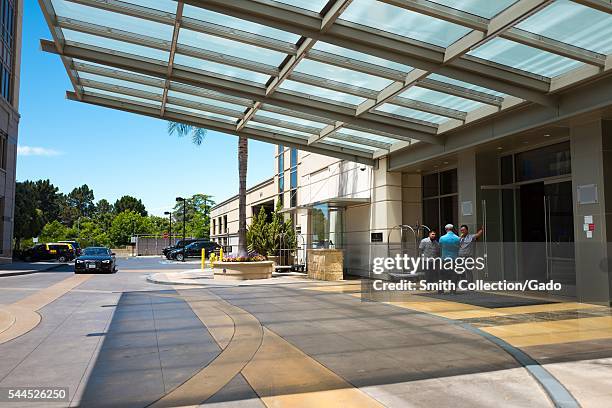 Bellmen await the arrival of guests outside the entrance of the Four Seasons Hotel Silicon Valley, East Palo Alto, California, 2016. The hotel is a...