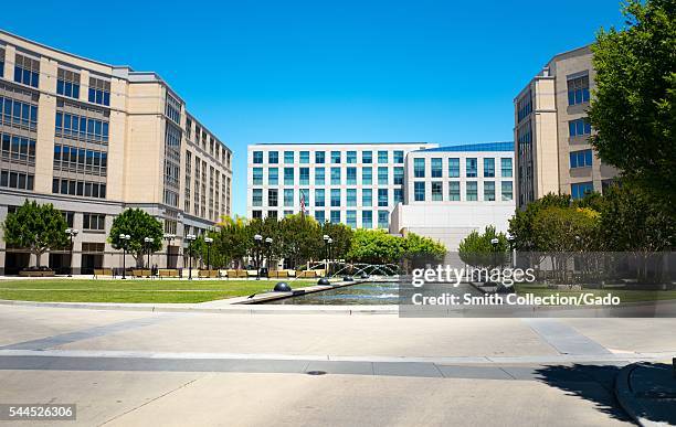 Fountains in the courtyard of the University Circle office complex, with top of the Four Seasons Hotel Silicon Valley visible, East Palo Alto,...