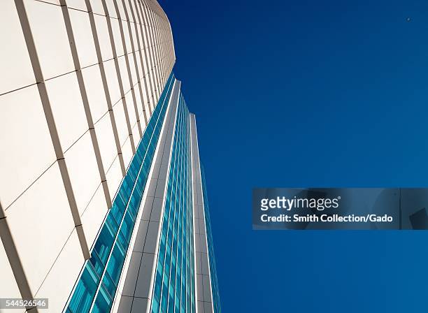 View up the side of the InterContinental Hotel, with a cloudless blue sky, in the South of Market neighborhood of San Francisco, California, 2016. .