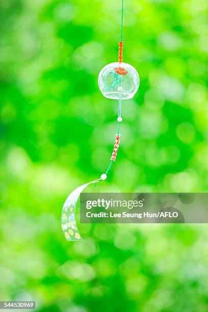 wind chime in a park - shaking hangs stock pictures, royalty-free photos & images