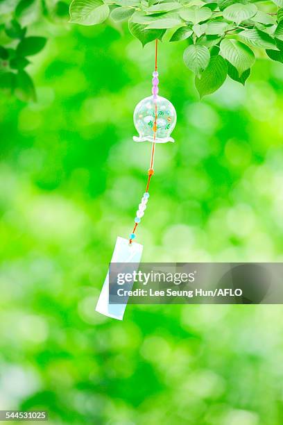 wind chime in a park - shaking hangs stock pictures, royalty-free photos & images