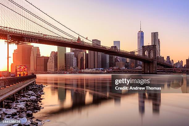 manhattan sunset from brooklyn bridge park - brooklyn bridge winter stock pictures, royalty-free photos & images