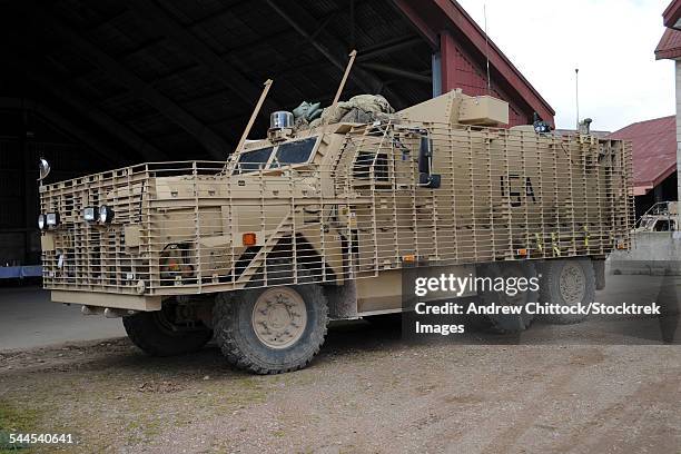 a mastiff 6x6 armored patrol vehicle of the british army. it is suitable for road patrols and convoys. - mastiff armoured vehicle stock pictures, royalty-free photos & images