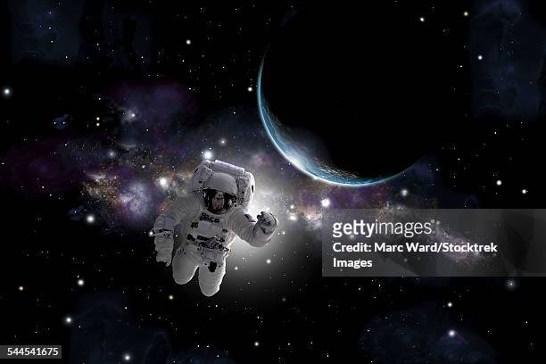 artists concept of an astronaut floating in outer space. - unrecognizable person photos stock illustrations