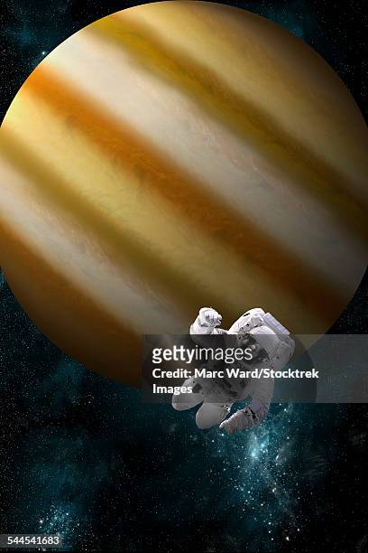 an astronaut floating in space in front of a jupiter-like planet. - unrecognizable person photos stock illustrations