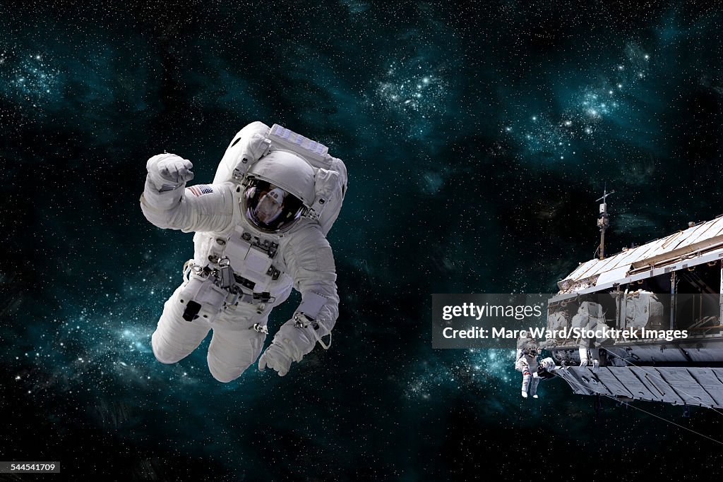 A galactic scene showing astronauts working on space station.