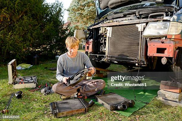 man working at old van outdoors - car toolbox stock pictures, royalty-free photos & images