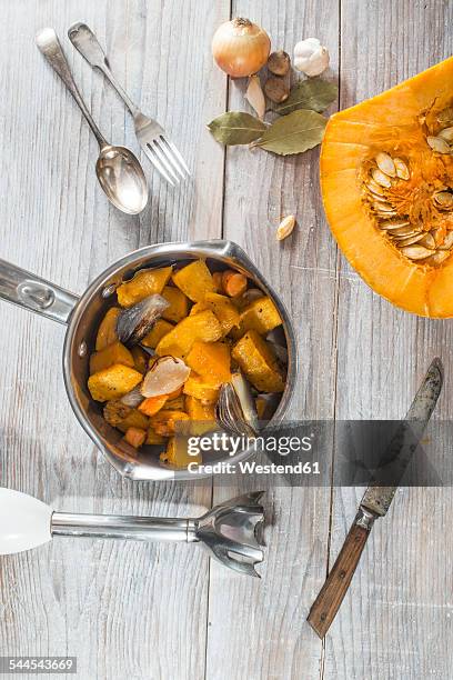 cooking of pumpkin soup - blender stock-fotos und bilder