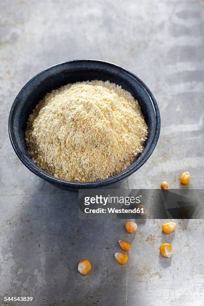 bowl of cornmeal and maize grains on metal - cornmeal stock pictures, royalty-free photos & images