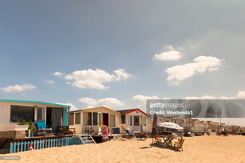 Netherlands, Waterland, beach huts at Ijsselmeer