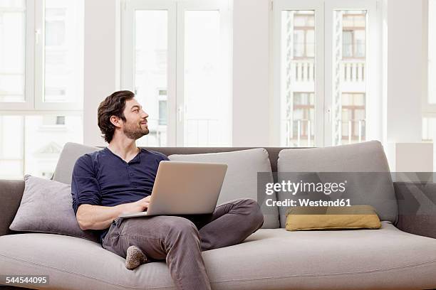 58,883 Sitting Couch Laptop Stock Photos, High-Res Pictures, and Images ...