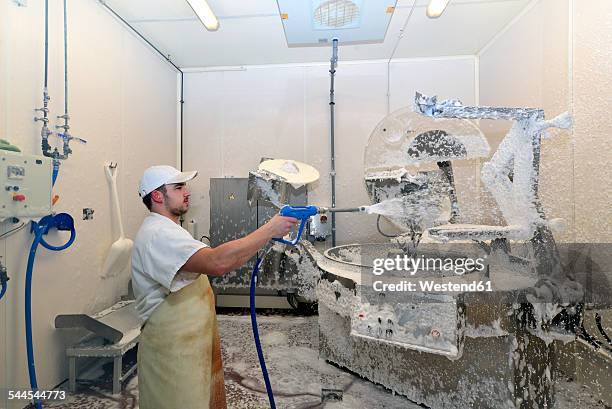 worker disinfecting interior of a butchery - spray foam stock pictures, royalty-free photos & images