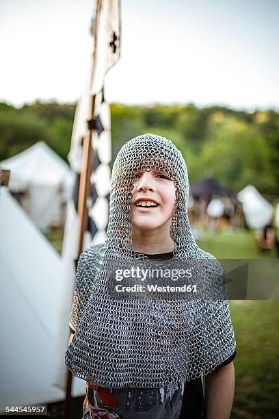 germany, baden-wuerttemberg, moensheim, boy in chain mail on medieval fair - chain mail stock pictures, royalty-free photos & images